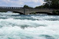 Goat Island pedestrian bridge over turbulent white waters Royalty Free Stock Photo