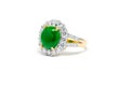 Green jade with diamond and gold ring isolated