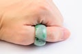 Green jadeite ring on hand Royalty Free Stock Photo