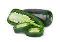 Green jalapeno peppers with half slice isolated on a white