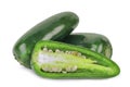 Green jalapeno peppers with half slice isolated on a white Royalty Free Stock Photo