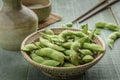 Green Japanese Soybean in wooden bowl on table wood