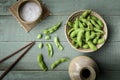 Green Japanese Soybean in wooden bowl on table wood