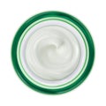 Green jar with white cosmetic cream. Top view. Make up products isolated on a white background. Royalty Free Stock Photo