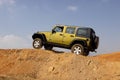 Green Jeep Wrangler Unlimited on 4x4 Course Royalty Free Stock Photo