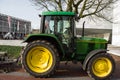A green John Deere farmer tractor