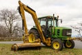 A green John Deere model 6430 tractor with A side hydraulic arm Royalty Free Stock Photo