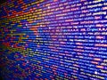 Green Json string blur background. Coding programmer abstract background. Closeup of Web Code on Computer LED Screen. Compressed Royalty Free Stock Photo