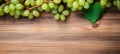 Green juicy grapes on wooden background