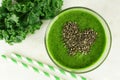 Green kale smoothie with chia seeds heart