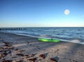 Green kayak on the white sand of Tigertail Beach in Marco Island Royalty Free Stock Photo