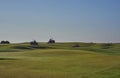 Green Keepers out on their Ride on Lawn Tractors mowing the Fairways and Greens at Carnoustie Golf course.