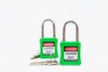 Green key lock and tag for process cut off electrical,the toggle tags number for electrical log out tag out on white background
