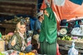 Green khimar in fruit booth at Terong Street Market in Makassar, South Sulawesi, Indonesia