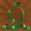 Green King Crown On Brown Background. Royalty Free Stock Photo
