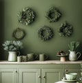 Green Kitchen With Wreaths on Wall