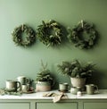 Green Kitchen With Wreaths on Wall