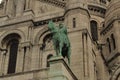 Green knight like sculpture outside of the Basilica of the Sacred Heart of Paris