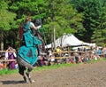 Green knight prepares for the spear throw.