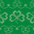 Green knitted clovers seamless pattern
