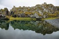 Green lagoon in black sand beach of Djupalonssandur