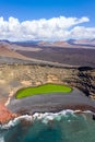 Green lake aerial view Charco de Los Clicos Verde near El Golfo on Lanzarote island portrait format on Canary Islands in Spain