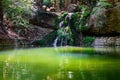 Green lake with small waterfall in Butterfly valley on Rhodes island, Greece Royalty Free Stock Photo