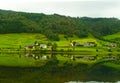 Green lakeside hills reflection on the water Seimsvatnet Norway