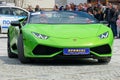 A green Lamborghini that is driving down the street Royalty Free Stock Photo