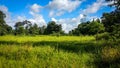 Green Landscape Nature with blue sky and clouds Royalty Free Stock Photo