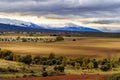 Green landscape with snowy mountains and dramatic sky in Somosierra Madrid Royalty Free Stock Photo