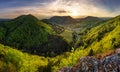 Green landscape with village, mountain and rocks at sunset, Nature