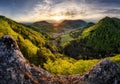 Green landscape with village, mountain and rocks at sunset, Nature