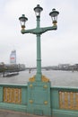 Green lantern on southwark bridge over river thames in london Royalty Free Stock Photo