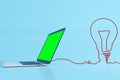 Green laptop with cable lamp