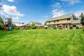 Green large fenced backyard with trees. Royalty Free Stock Photo