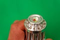 green laser light chrome metal flashlight front Royalty Free Stock Photo