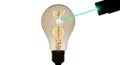 Green laser pointer illuminating a dna double helix inside a glowing light bulb on a white background Royalty Free Stock Photo