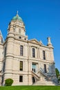 Green lawn and blue sky day with partial view of Whitley County Courthouse entrance with steps Royalty Free Stock Photo