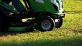 Green lawn mower tractor. Royalty Free Stock Photo