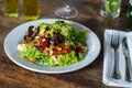 Green leafy salad with tomatoes and nuts