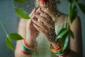 Green leaves and raindrops with reflection of bangled hands for Hariyali Teej Royalty Free Stock Photo