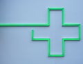 Green led cross on a pharmacy wall Royalty Free Stock Photo