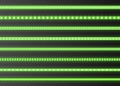 Green LED strips collection, bright luminous ribbons isolated on a transparent background. Realistic neon garlands.