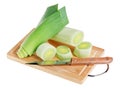 Green leek with knife on wooden chopping board Royalty Free Stock Photo