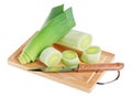 Green leek with knife on wooden chopping board