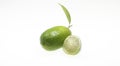 Green lemon full and slice isolated on a white background with clipping path Royalty Free Stock Photo