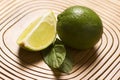 green lemon and mint on wooden background Royalty Free Stock Photo