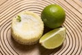 green lemon tart and mint on wooden background