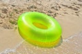 Green life buoy on beach Royalty Free Stock Photo
